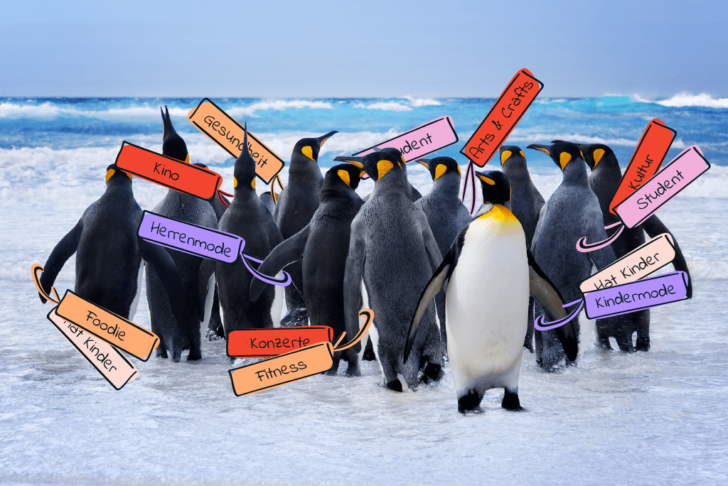 Pinguine mit verschiedenen Schildern umgehängt